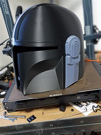 The Din Djarin helmet is printed. I'll be printing a number of things in resin that have little details, like the ears on the helmet and the gauntlets. I'm currently sizing the gauntlets on my FDM by just printing small sections on my FDM printer. #3dprinter #mando #starwars #mandalorian #resinprinting