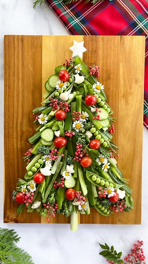 Alaura Berry on Instagram: "It’s Crudi-Tree Szn 🎄and one of my favorite ways to serve veggies during the holidays! Here’s what I used for the tree: • cucumbers • celery • green peppers • sugar snap peas • rosemary Here’s what I used to decorate the tree: • cherry tomatoes • cauliflower • jicama star for the tree topper • pink peppercorn • chamomile flowers Serve with dips on the side for your guests to enjoy!"
