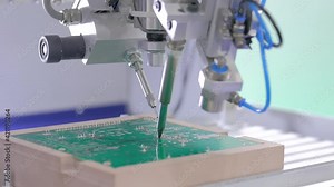 Automated technology, industrial, robotic, electronic, production, manufacturing concept. Close up: process of selective soldering components to printed circuit board at exhibition, factory Stock Video