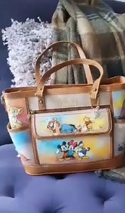 10K views · 106 reactions | "I’m in love with this bag from @bradfordexchange! It has all my favorite characters, and they’re so artfully styled! It’s a portable, practical piece of art!" We're so glad you love it, @4disneyfashion. Click to shop: https://bit.ly/3LB8EBL #Disney | The Bradford Exchange | Facebook