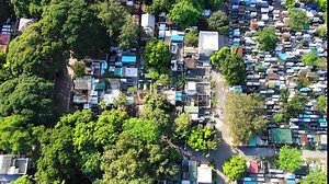 Aerial view of the Manila South Cemetery in metro manila.It is part of San Andres,manila Philippines surrounded by a lot of trees and the outlook view of graveyard above.