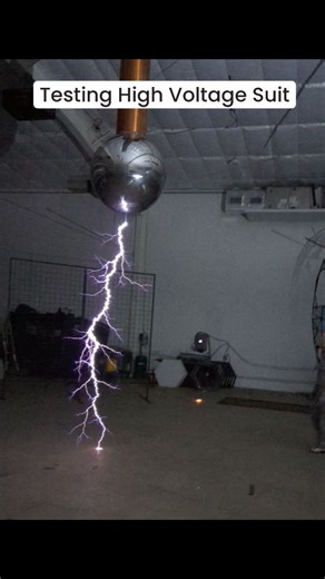 Carla dons a Faraday suit and bravely strolls beneath the arcs of a Tesla coil. Faraday suits, acting like mobile Faraday cages, allow the wearer to be surrounded by electricity without being harmed. This encounter isn't just a party trick; it's a bold demonstration of physics in action. #arcattack #teslacoil #faraday #lightning | ArcAttack