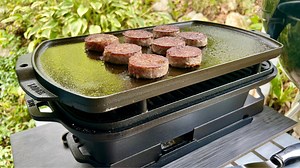 I love to tinker, and in doing so during the maiden voyage of my new Lodge Cast Iron Sportsman’s Pro Grill, I discovered that their 19” reversible griddle/grill is the perfect companion! And yes, I believe it would work just the same with the previous version of the grill. I took the new Sportsman’s Pro to our family cabin in Pennsylvania a couple of weeks ago. In an area surrounded by Amish culture, the cabin was built by my grandfather, handed down to my father, who passed away in 2019. Most o