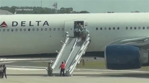 Delta plane catches fire at Orlando airport
