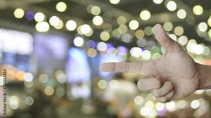 Question mark sign icon on finger over blur light and shadow of shopping mall, Business customer service and support concept