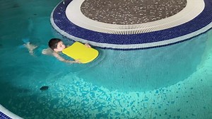 A Boy Learns To Swim in a Swimming Pool. Stock Video - Video of support, childhood: 393974317