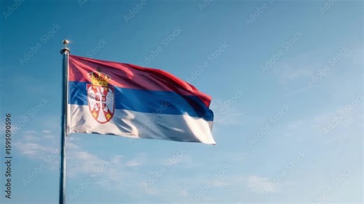 The Serbian flag proudly displays its colors and emblem in the sky, marking the celebration of Independence Day in Serbia.
