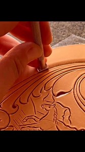 Another oval round wallet in the works! Hand tooled leather featuring classic Clair Kehrberg scrollwork and a wild horse running through the mountains all surrounded by a creative geometric border design. #clairkehrbergmaker #leathergoods | Clair Kehrberg ~ Fine Leather Art