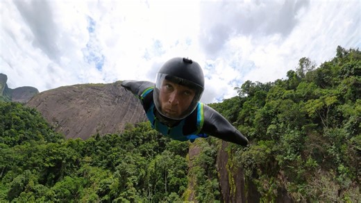 Man launches a wingsuit BASE jump off Zorzi’s Ramp in Brazil.