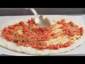 Pizza Margherita being made