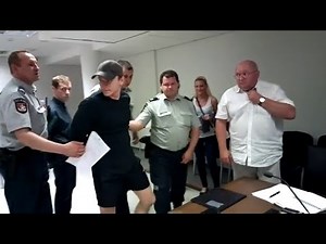 Prisoners handcuffed in court