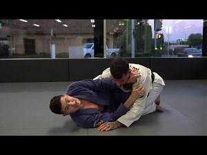 LOOP CHOKE WITH THUMB DOWN FROM HALF GUARD
