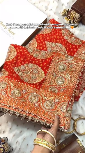 ROOP RANI SAREES on Instagram: "Presenting this Rust Orange special pure Khaddi Georgette Bandhani saree adorned with intricate zardozi hand embroidery, blending timeless tradition with rich craftsmanship. Its vibrant colors and detailed handwork create a stunning statement piece, perfect for festive moments, grand celebrations, and capturing attention with effortless regal charm. Now available to book online on Instagram via DM’s. For any queries, DM us on Instagram or Contact us via call or Wh