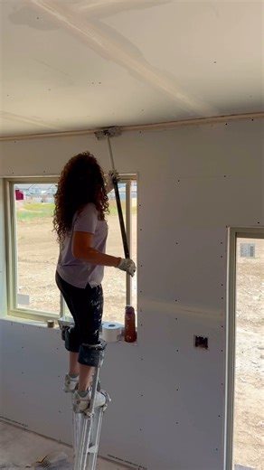 DrywallShorty - Lydia Crowder on Instagram: "Rolling some upper angles. 9ft so I jump up on stilts to make sure I have the right angle. Mud is pretty thin to make sure the angles are tight! #reels #drywall #construction #homebuilders"