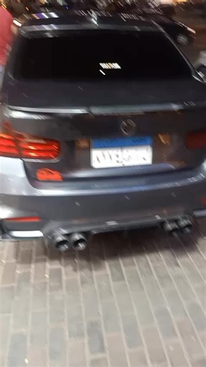 Exploring a Dark-Colored BMW in Urban Setting