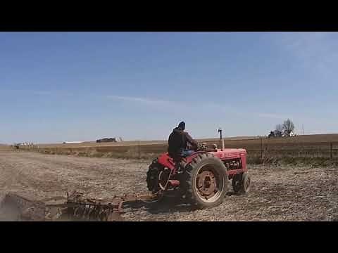 1947 Farmall H pulling a 10' disc