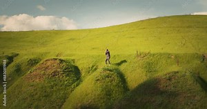 Young boxer man training in the mountains. Boxing outside training. Shadow boxing in sunset light