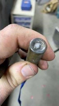 Removing a broken bolt from a lawnmower support shaft. #HandsomeOrHandy #BrokenBolt