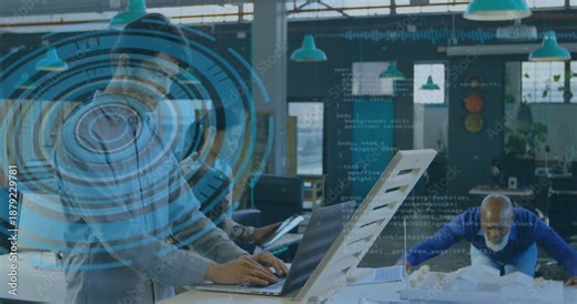 Standing man typing on laptop, activating blue HUD and code overlay assisting design model review