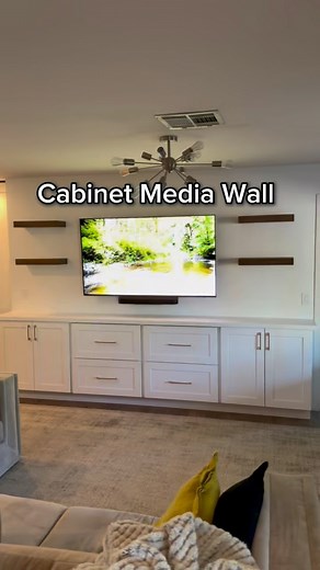 Here’s a simple and elegant media wall idea. Use some 12” deep wall cabinets if you don’t have a custom shop, build them up on a toe kick, and you’re done! We made a custom miter fold countertop with hidden seams, but you could also use butcher block or any hard surface, along with custom floating shelves! Let us know what you think! DM us for a quote (Arizona only) #mediawallideas #storage #custom #livingroomdesign #designideas #mediawall #cabinets #designtrends #walldecor #accentwall #inspo #i