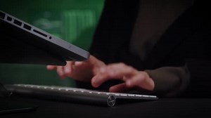 Close up of hands of unrecognizable hacker typing keyboard. Cyber crime computer attack