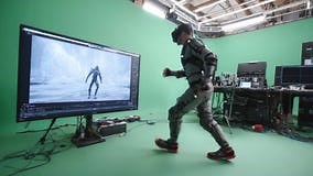 Captivating Motion Capture Scene: A Performer Dons an Advanced Motion Capture Suit as They Interpret Character Movements