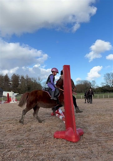 Adorable 5-Year-Old Jumping with Her Pony