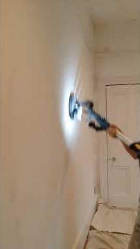 Using a drywall sander to sand down walls