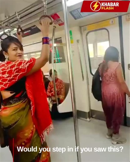 KhabarFlash on Instagram: "A viral metro clip shows a woman aggressively kicking another woman out of the train as the doors open, while fellow passengers look on without intervening. The incident has sparked debate online about bystander behaviour, public etiquette, and safety on public transport. Many users have questioned why no one stepped in to de-escalate or help. _______________ Metro, PublicTransport, ViralVideo, AwarenessPost, BystanderEffect, SocialBehavior, PublicEtiquette, ViralReels