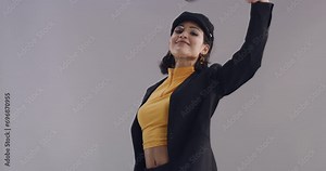 Cool, face mask and woman with fashion and style in studio and remove protection with a dance. Background, aesthetic or portrait of person with confidence, energy and model with happiness and a smile
