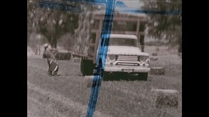 United States CIRCA 1960s: Train moves past industrial plant. Animated map. Beach. River. Men and child work in field. Plants sway in breeze.