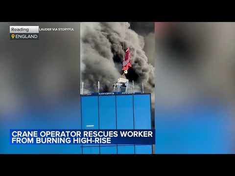 Crane operator rescues man from burning high-rise in England