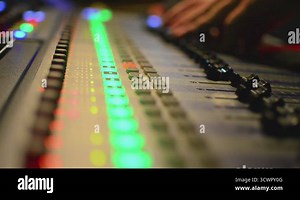 Audio Engineer Working. An audio engineer trims a file to specs. Engineer hand in the background. Shallow focus/focus on faders Stock Video Footage - Alamy