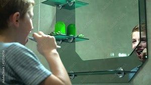 Young boy brushing teeth in bathroom Stock Video