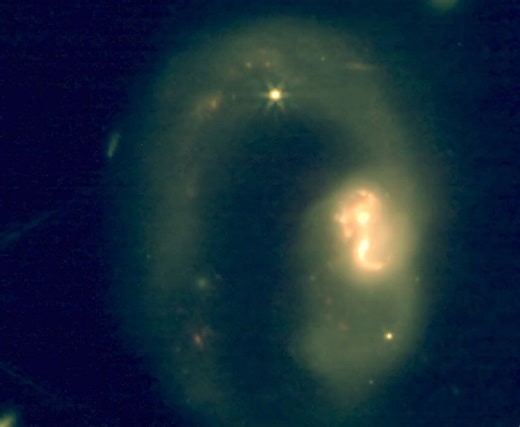 Astronomers discover a hidden factory of organic molecules in a dust-shrouded galaxy