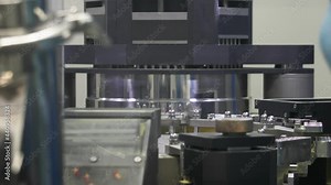 Medical technician checks the production process. Medical encapsulation machine. Powder filling of capsules caps.Capsules are sent to different workstations with the help of a turntable.Pharmaceutical Stock Video