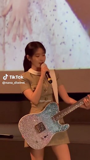 IU Performs 'Bye Summer' with Guitar at Concert