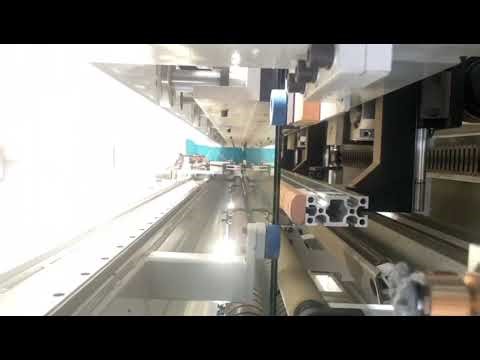 Laminated glass machine with automatic loader