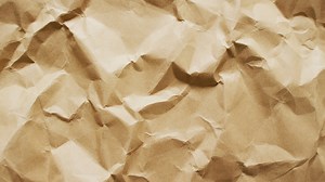 Premium stock video - Video of close up of crumpled brown paper texture background