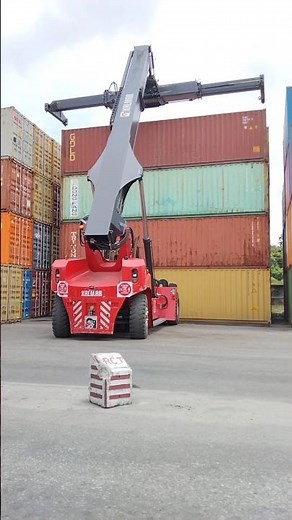 Kalmar Reach stacker with a tilting spreader for container handling