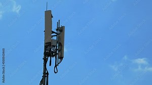 4k Time lapse of Cell tower antennas transmitting data, repeaters for mobile communications and the Internet, GPS, cellphone, 3G, 4G and 5G telecommunication tower with moving clouds, storm.