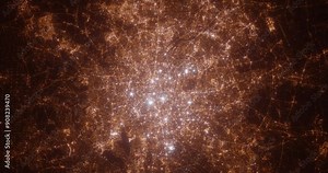 Berlin (Germany) aerial view at night. Top view on modern city with street lights. Camera is zooming out, rotating counterclockwise. Vertical video. The north is on the left side