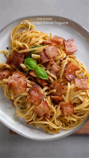 Lalada. on Instagram: "Stir-Fry Crispy Bacon Linguine Quick & Easy/ Classic dishes with a twist / 30-minute meals Ingredients 6 strips of bacon 1 tbsp unsalted butter 3 cloves garlic, thinly sliced 100 g linguine pasta 2 tbsp olive oil 1 tsp roasted chili flakes Salt and pepper to taste Fresh basil leaves Instructions • Preheat oven or air fryer to 400°F (200°C). Bake bacon on a lined tray for 12–15 minutes, or until crispy. • Cut the cooked bacon into small pieces and set aside. • Cook linguine