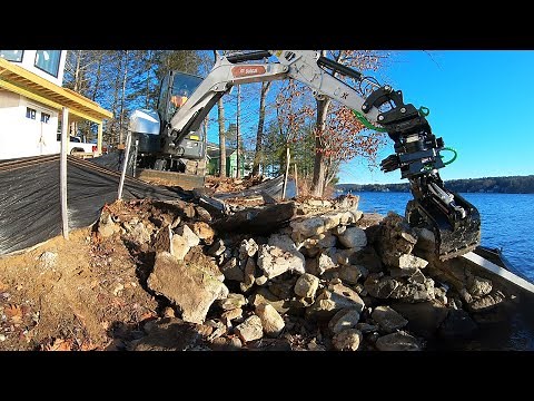 Demolishing a Lake Wall with a Tilt Rotator