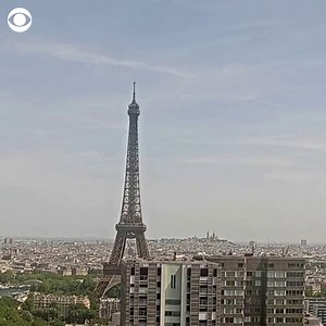 SMOKE OVER PARIS: This timelapse shows a dark plume of smoke rising behind the Eiffel Tower in Paris on Tuesday as a warehouse fire burned in a nearby French suburb. | CBS News
