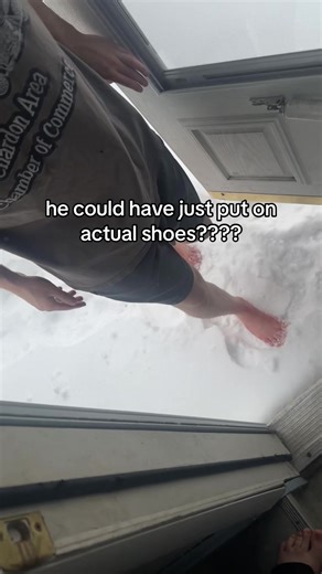 Coldest day of the year and bro’s just walking around barefoot in the snow… #whyaremenlikethis #funny #midwest #friendships #snowstorm
