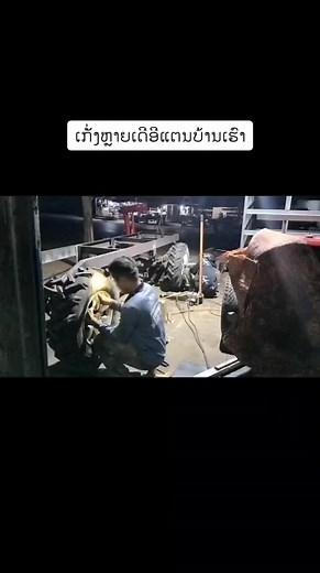 Tractor Wheel Repair in Workshop Setting