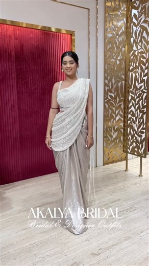 Akalya on Instagram: "This one-of-a-kind creation features a pre-draped silhouette, gracefully embellished with pearls that flow like poetry. Effortlessly elegant, endlessly captivating 🤍✨ Flagship Stores: 📍 Akalya Bridal, RCM Imperia, Kanchan Bagh, Indore 📍 Akalya, Parekh Heights, Indore 📍 Anupam, Dalu Modi bazar, Ratlam 📞 For Enquiries - +919424021217 [festive, bridal wear , 2025, lehenga, outfits, Indian wear, suits, indowestern , kurtas, trending outfit, love, weddings] #indowestern #co