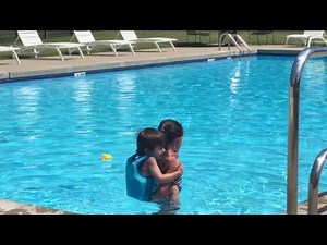 Piggy back ride in the pool 1