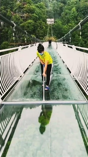 Glass bridge cracks and collapses.
